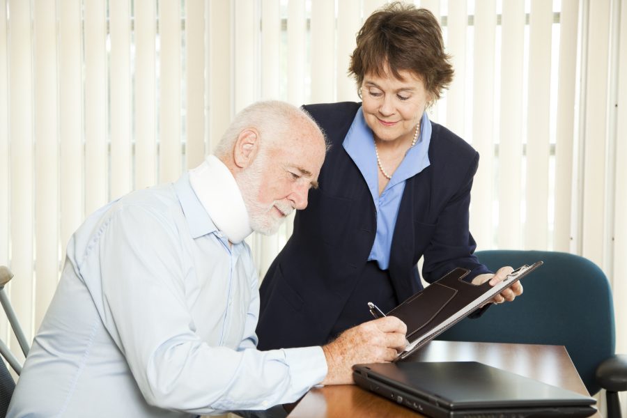 Personal injury lawyer signs up a new injured client.